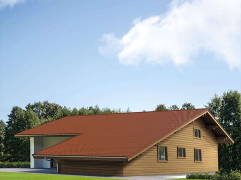 Wohnhaus mit einem Dach aus kupferbraunem Ziegelblech, passend zur natürlichen Umgebung und blauem Himmel