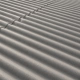 Detailansicht der naturgrauen Faserzement Wellplatten Europa Profil 5 auf einer Dachflaeche