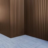 Trapezblech 20/1100 in Sepiabraun als Eckverkleidung einer Wand