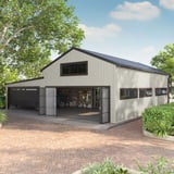 Trapezblech T18DR Grauweiß an einer Lagerhalle mit Garagentoren