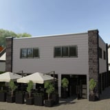 Trapezblech T35DR Graualuminium als Wandverkleidung an einem Gebaeude mit Aussenbereich