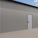 Trapezblech T7M Wand Graualuminium RAL 9007, 0,50 mm, Polyester 25 µm, an einer Gebaeudewand verbaut